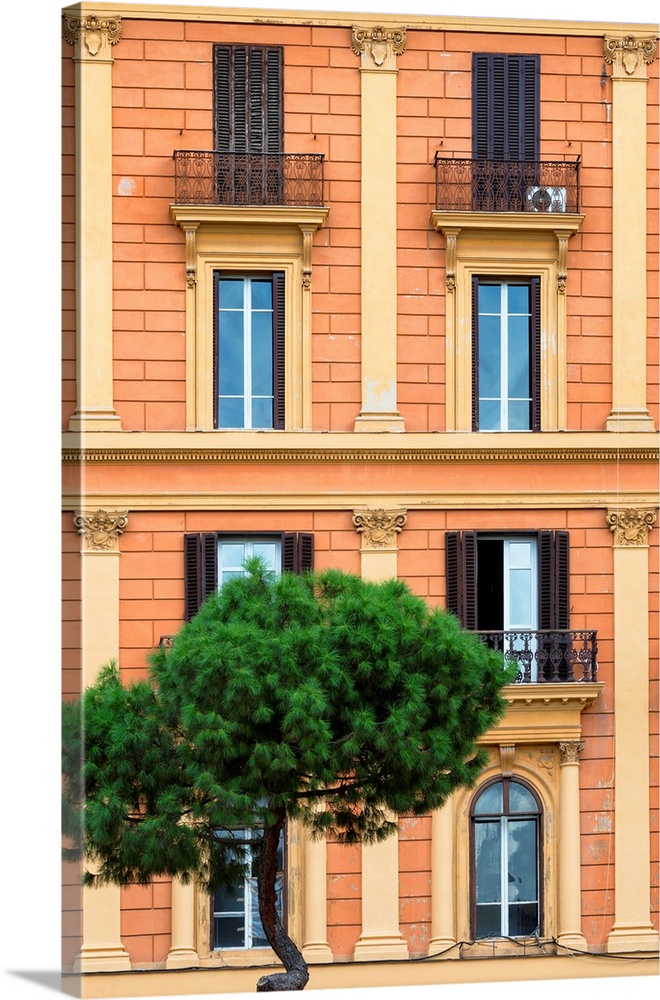 It's a orange facade of a building in the city of Rome in Italy.