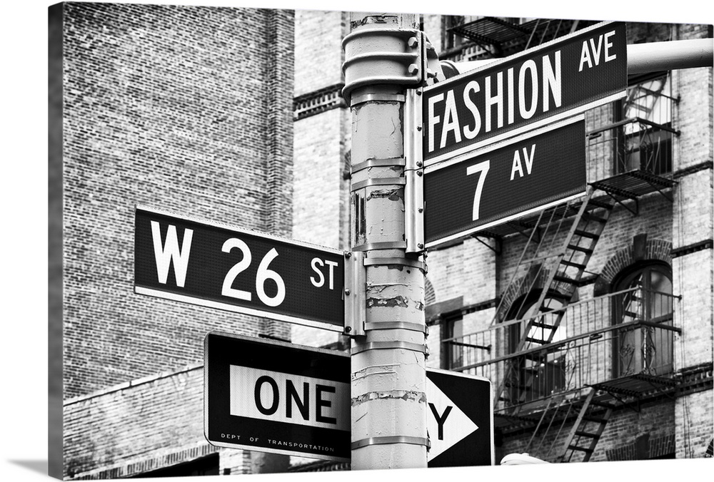 Post with street signs for West 26th street, Fashion Avenue, and 7th Avenue in New York.