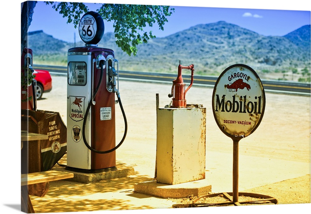 A vintage gas pump and a rusted sign for Mobiloil at a gas station on Route 66.