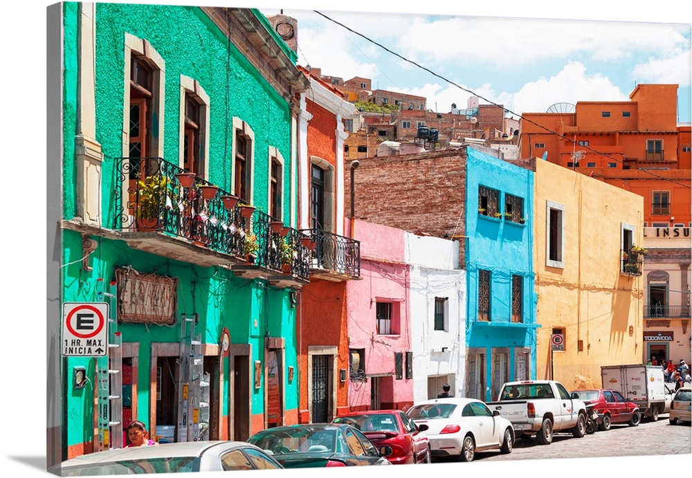 Vertical photograph of a colorful streetscape in Guanajuato. From the Viva Mexico Collection.