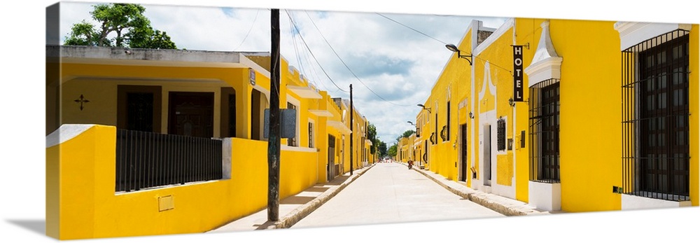 Panoramic photograph of a bright streetcape in the Yellow City, Izamal, Mexico. From the Viva Mexico Panoramic Collection.