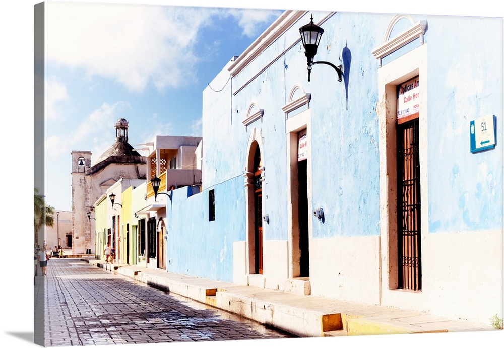 Photograph of a Campeche street view with a light blue building in front. From the Viva Mexico Collection.