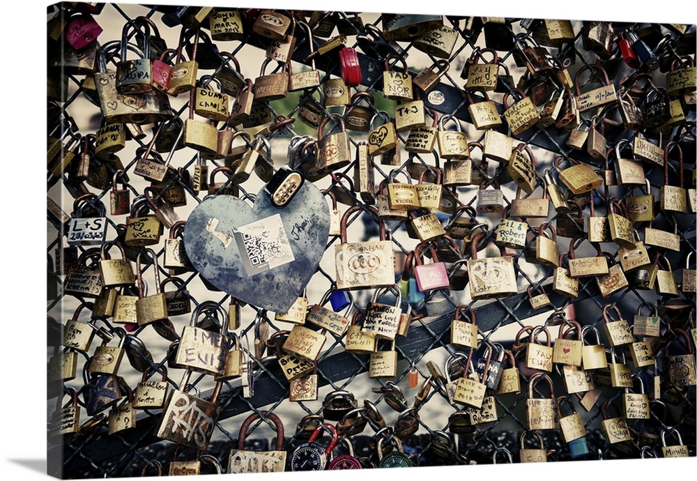Collection of locks left by couples on the Pont des Arts in Paris, France.