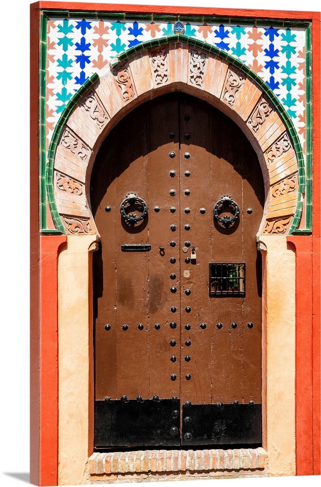 It's an old colorful wooden door arabic style in Granada, Spain.