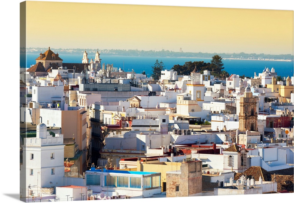 It's a view of the buildings of the city of Cadiz in Spain at Sunset.