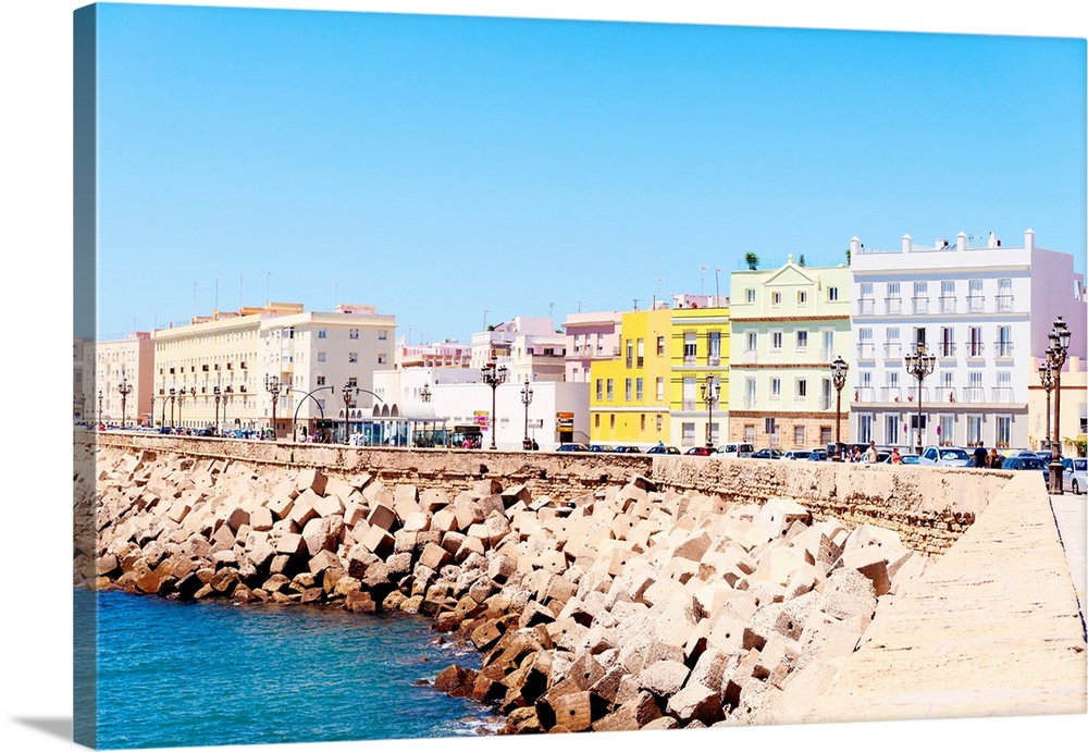These are the colorful buildings located in front of the seaside in Cadiz in Spain.