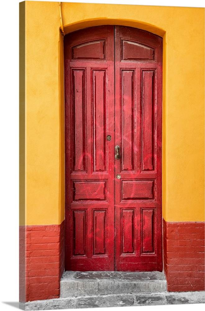 It's an old red door in a street of Seville in Spain.