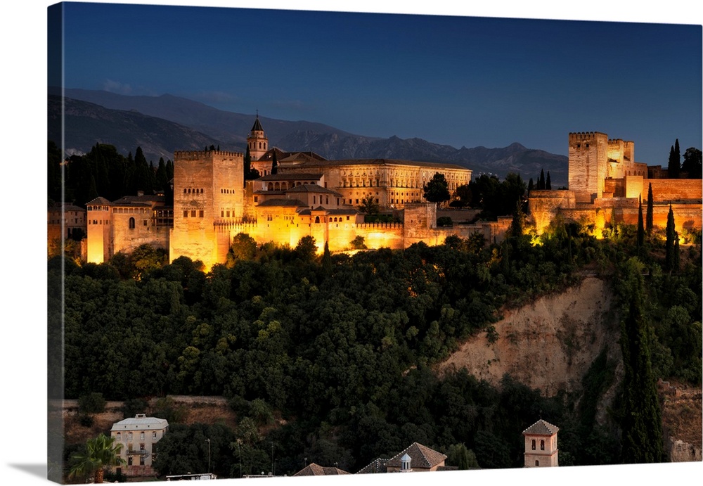 It's a magnificent view of the Alhambra by night in Granada, Spain.