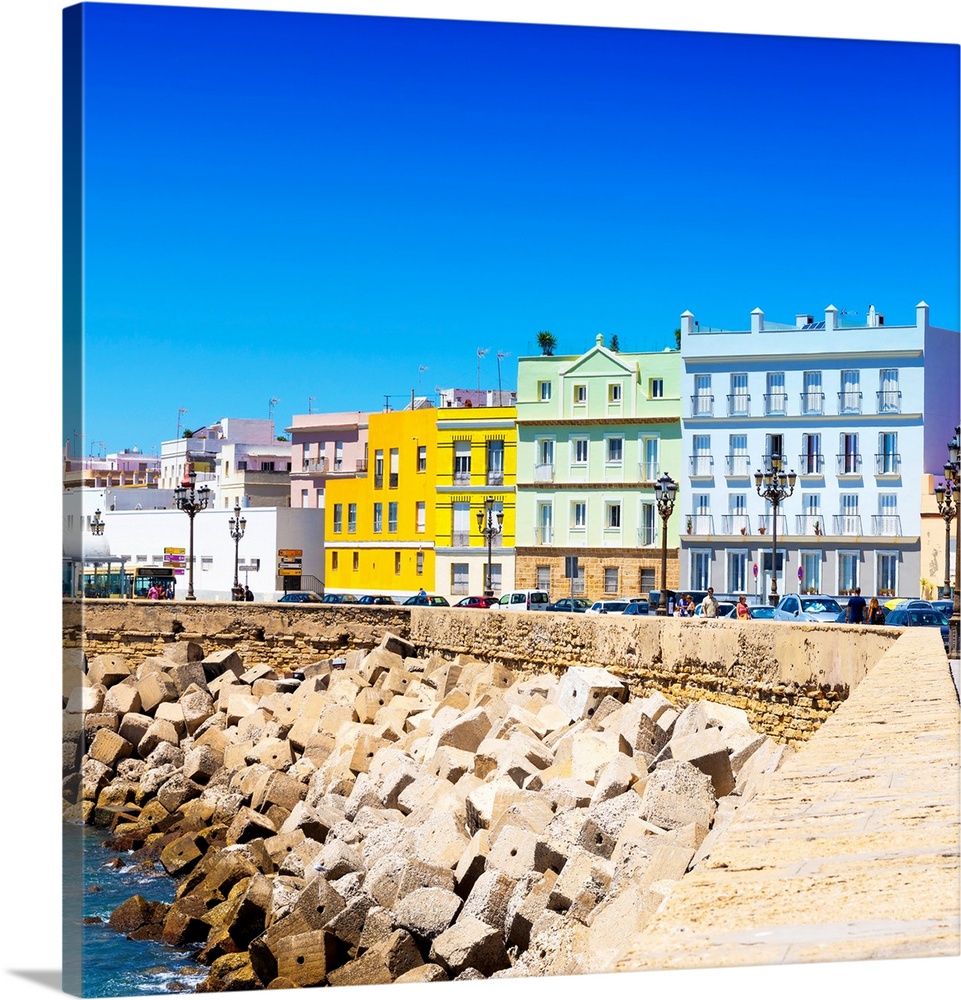 These are the colorful buildings located in front of the seaside in Cadiz in Spain.