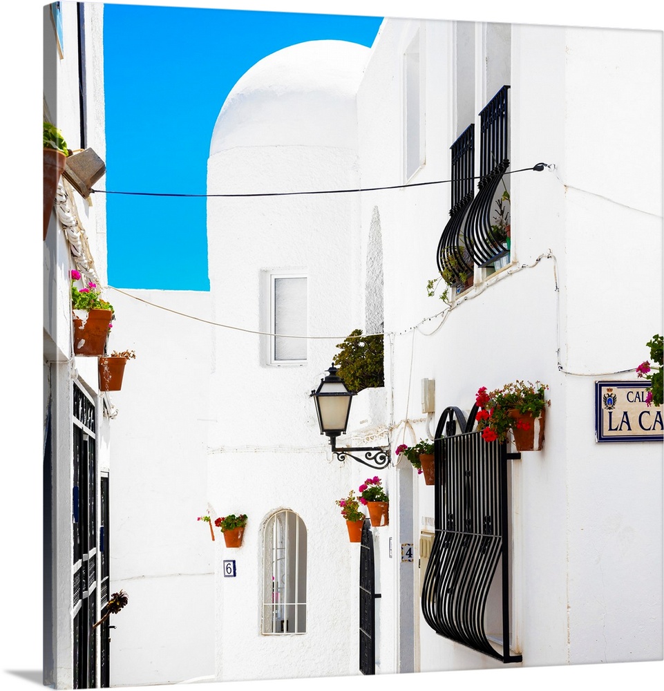 It's a street with white facades in Mojacar, Spain.