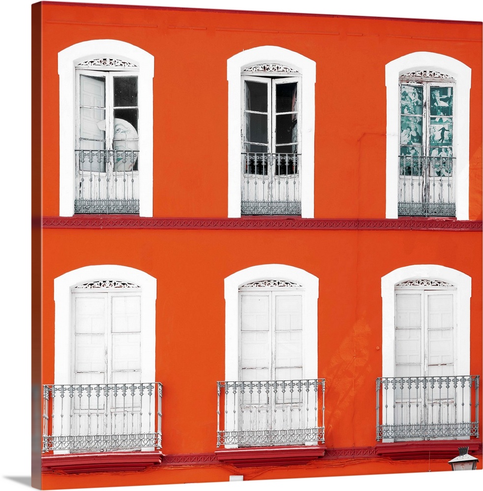 It's a beautiful orange facade of an old building in Seville, Spain.