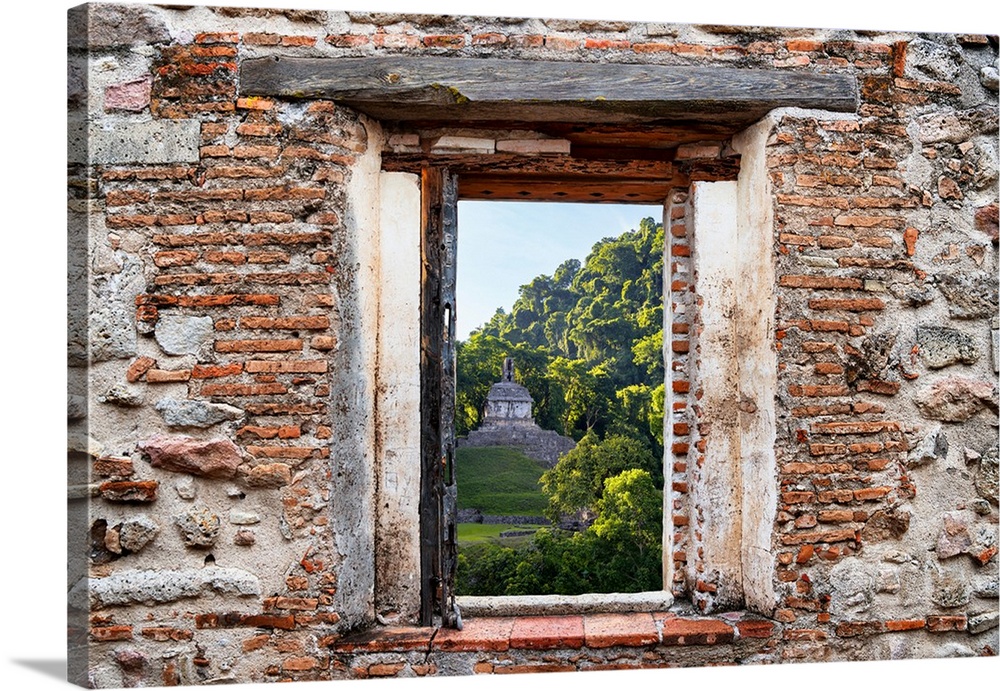 View of the sunrise over the Mayan Ruins in Palenque, Mexico, framed through a stony, brick window. From the Viva Mexico W...