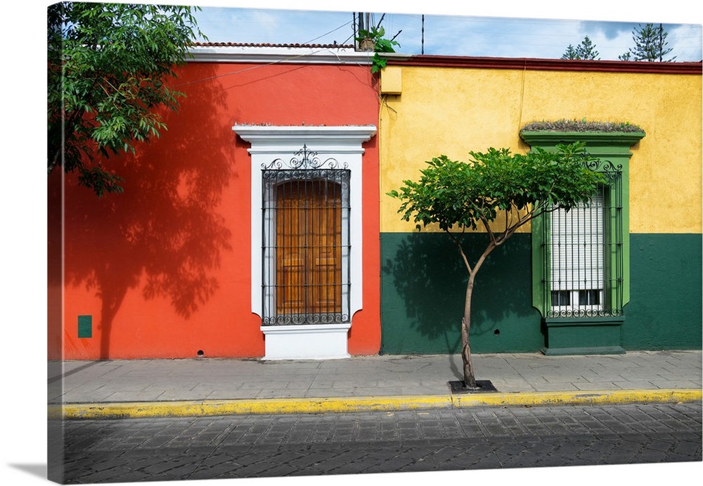 Photograph of colorful facades in Mexico in red, yellow, and green. From the Viva Mexico Collection.