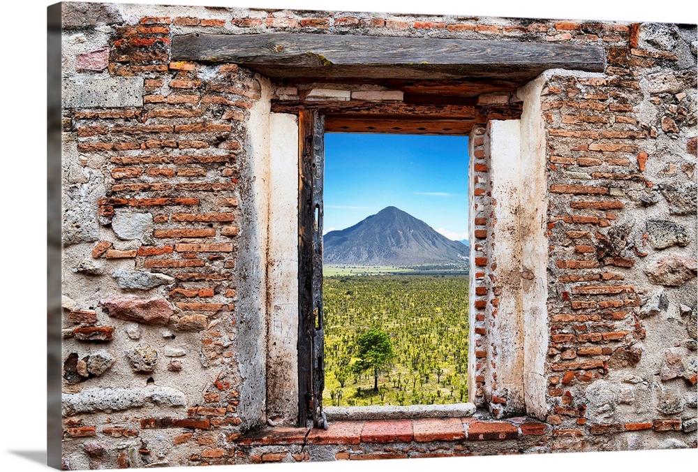 View of the Mexican desert with a mountain in the background framed through a stony, brick window. From the Viva Mexico Wi...