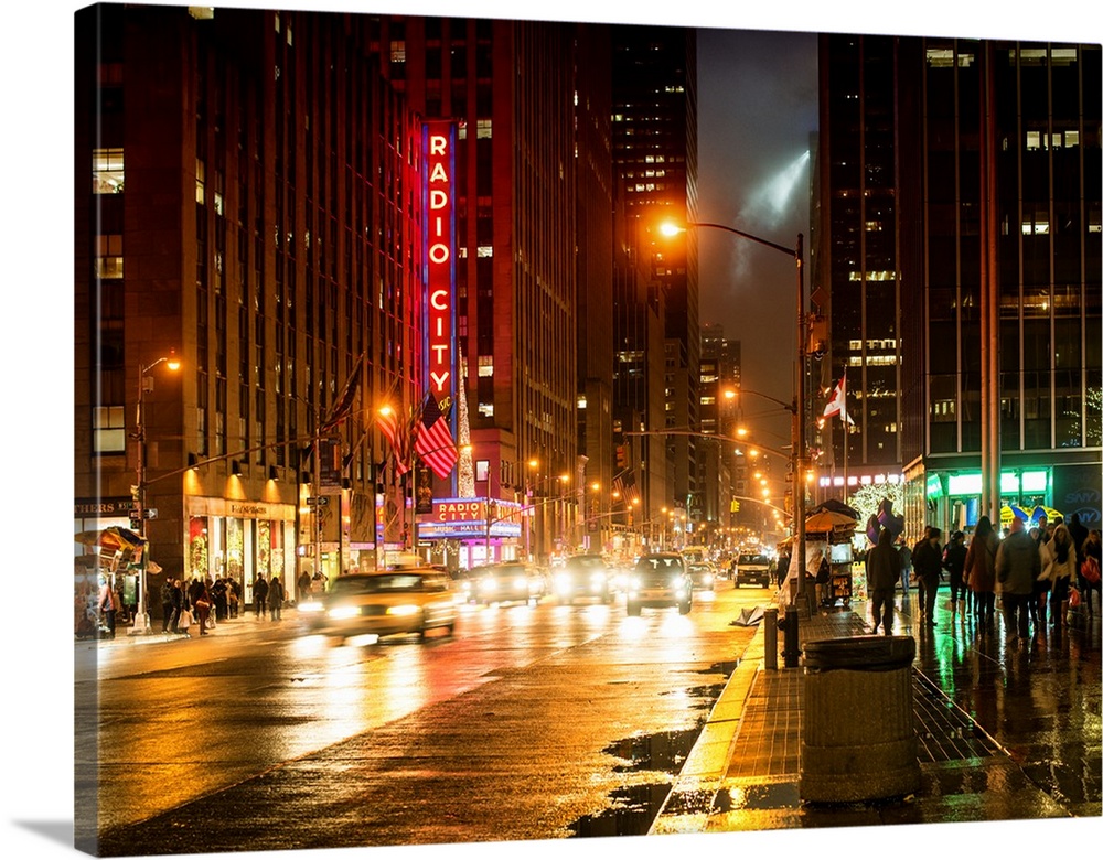Art photograph of New York city at night, with the Radio City sign lit up in neon.