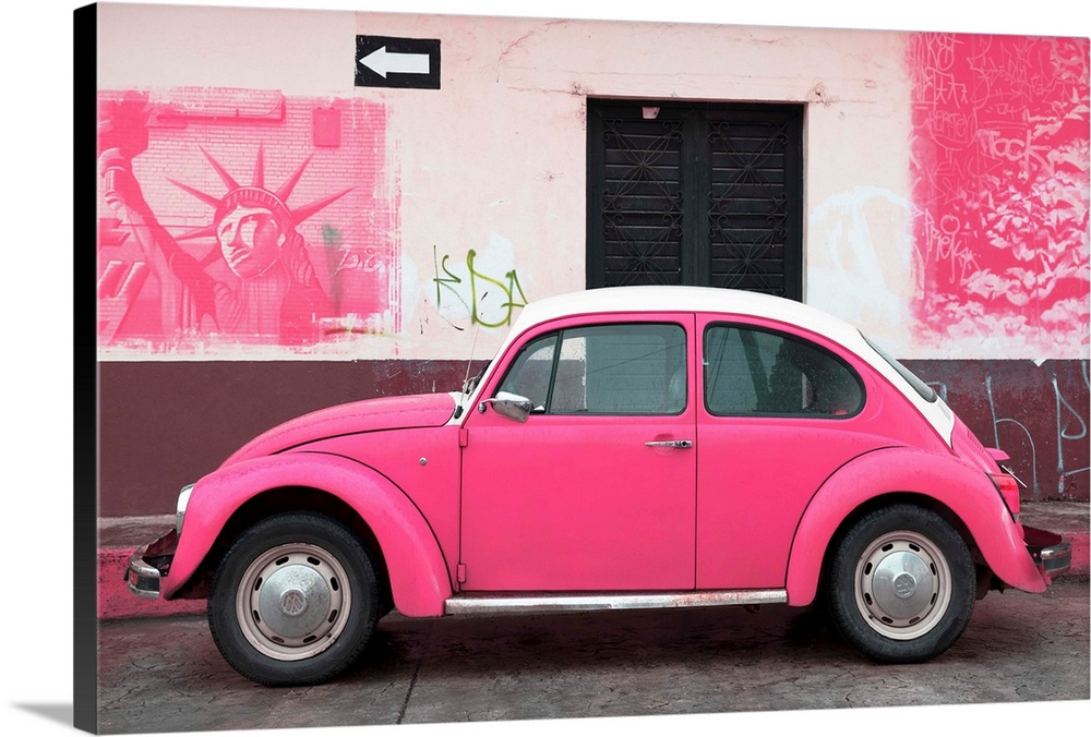 Photograph of a pink Volkswagen Beetle parked in front of a wall covered in pink American graffiti, Mexico. From the Viva ...