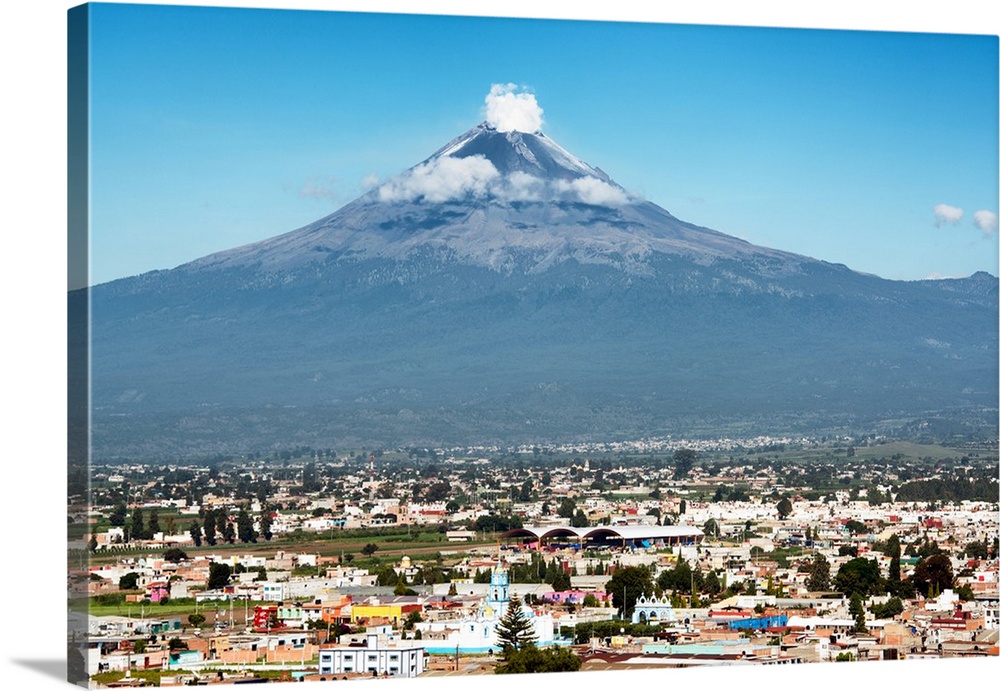 Photograph of the Popocatepetl Volcano in Puebla, Mexico with a view of the city below. From the Viva Mexico Collection.