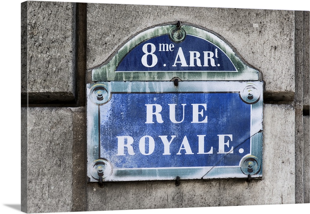Photograph of a Parisian sign against a stone wall.