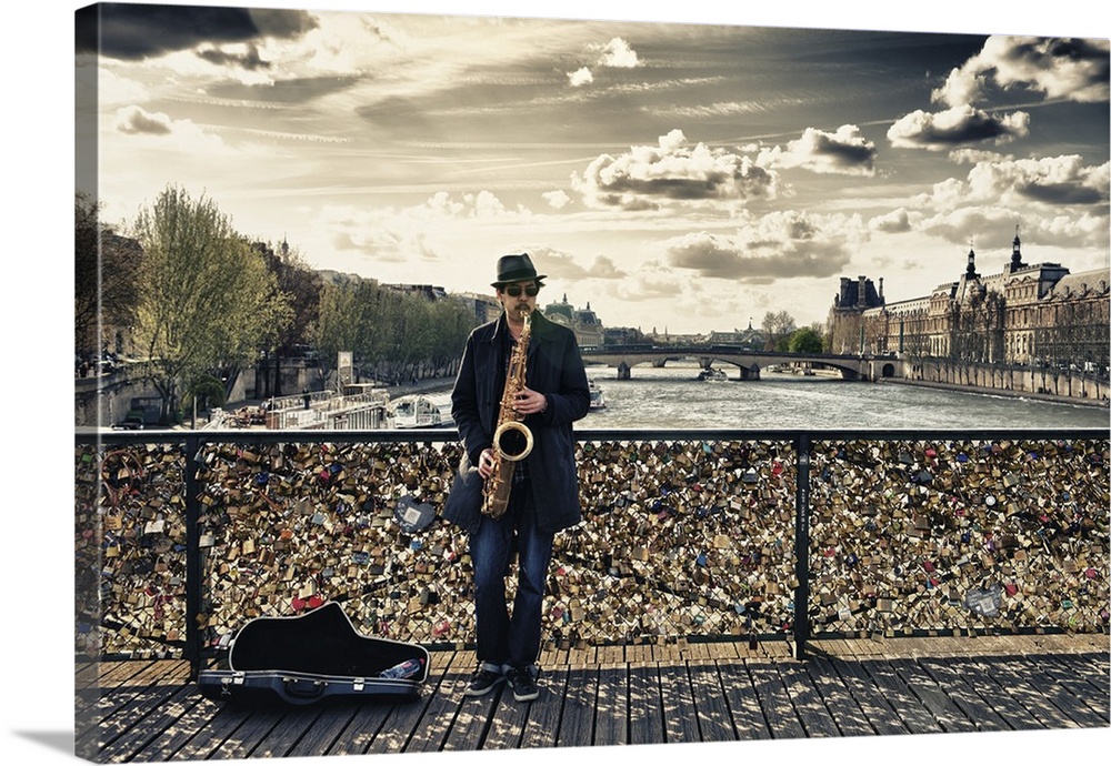 Fine art photo of a man playing the saxophone on bridge covered in locks in Paris, France.