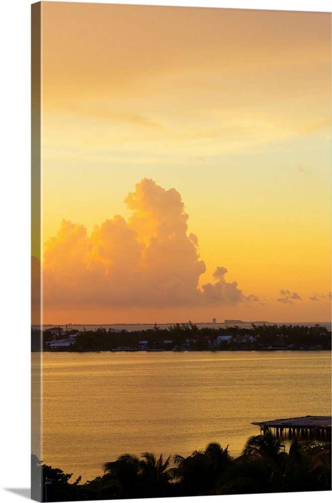 Photograph of a beautiful orange, pink, and yellow sunset over Cancun, Mexico. From the Viva Mexico Collection.