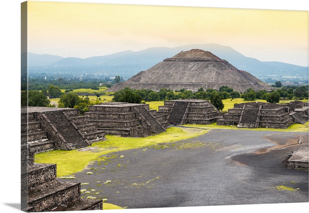 Photograph of the ancient pyramids in Teotihuacan, Mexico, featuring the Pyramid of the Sun and a warm sky. From the Viva ...