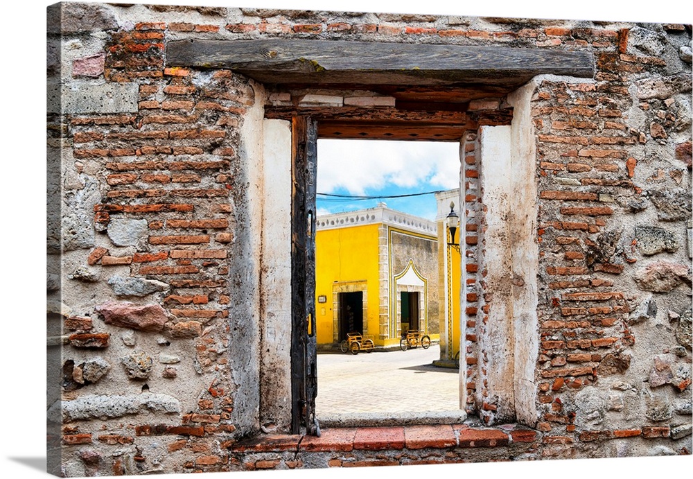 View of Izamal (The Yellow City), Mexico, framed through a stony, brick window. From the Viva Mexico Window View.