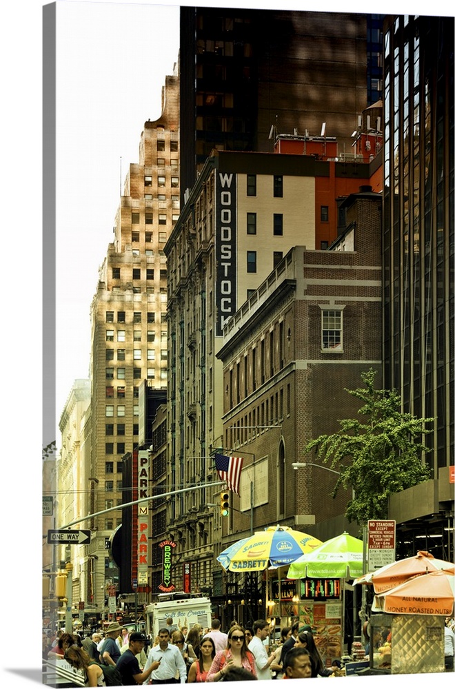 Fine art photo of a crowded street and tall buildings in Manhattan.