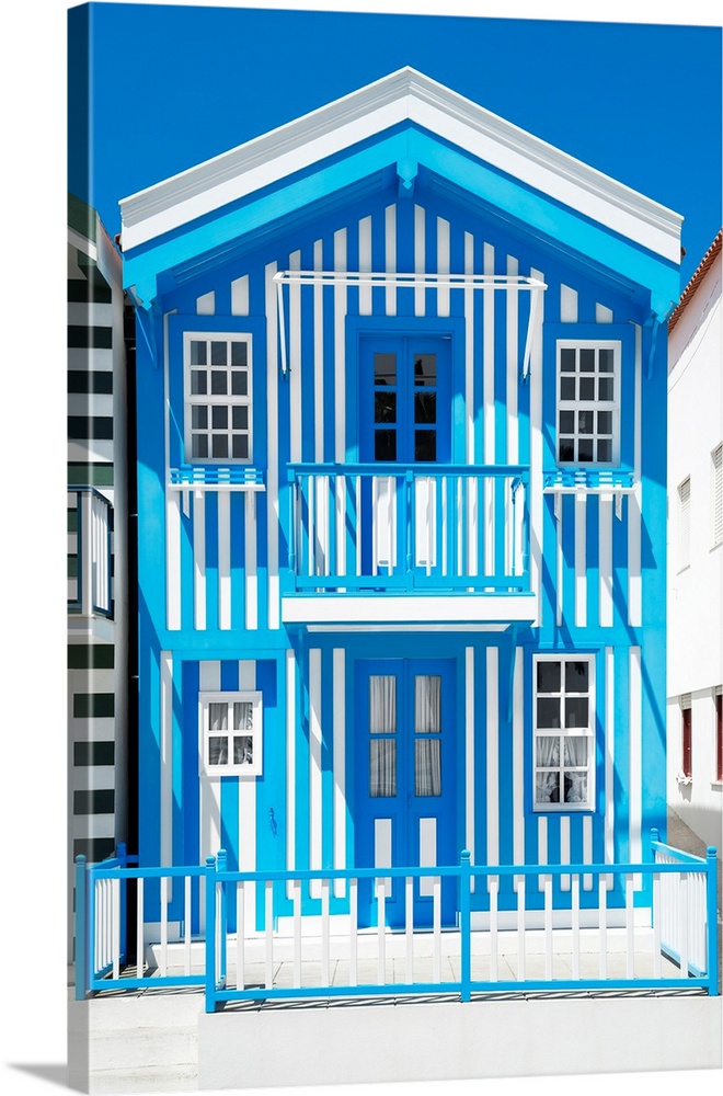 Its' a typical house with blue stripes in Costa Nova Beach, Portugal.