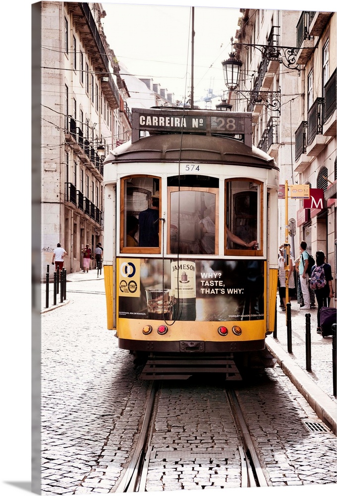 This is the famous old yellow tramway 28 in the streets of lisbon in Portugal.