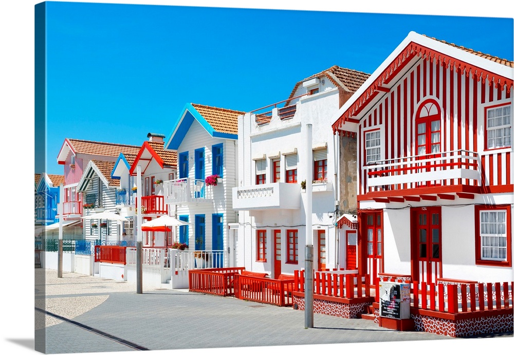 These are colorful white houses with stripes in Costa Nova Beach, Portugal.