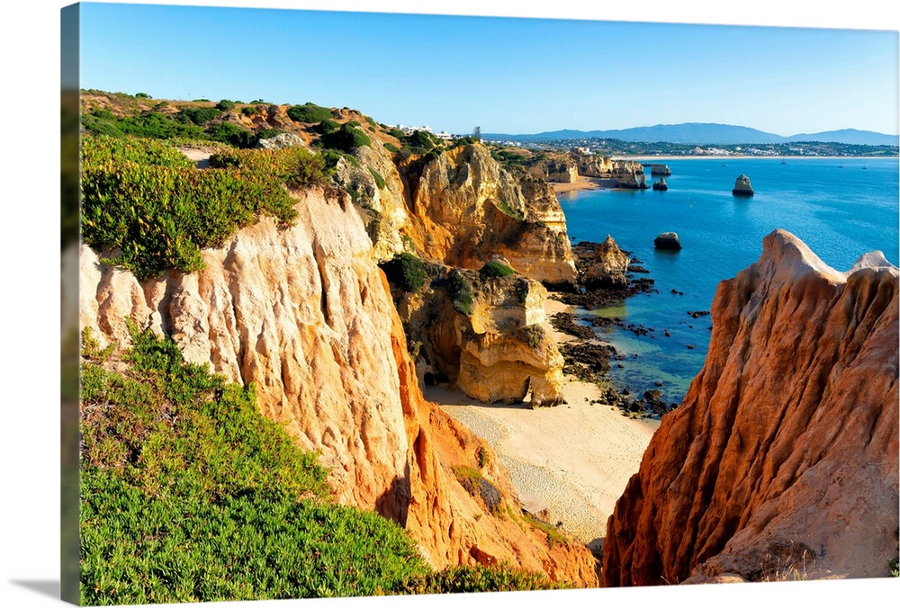 It's a view of Lagos beach (Praia do Camillo) and orange cliffs in Portugal.