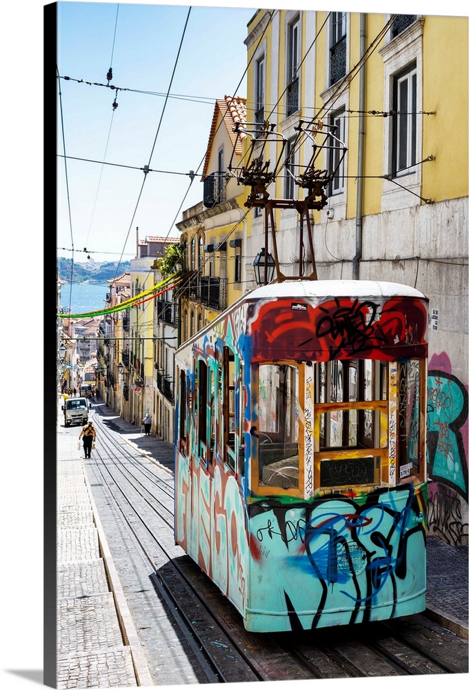 It's the funicular of Bica with graffiti in the street Da Bica in Lisbon with colourful facades in Portugal.