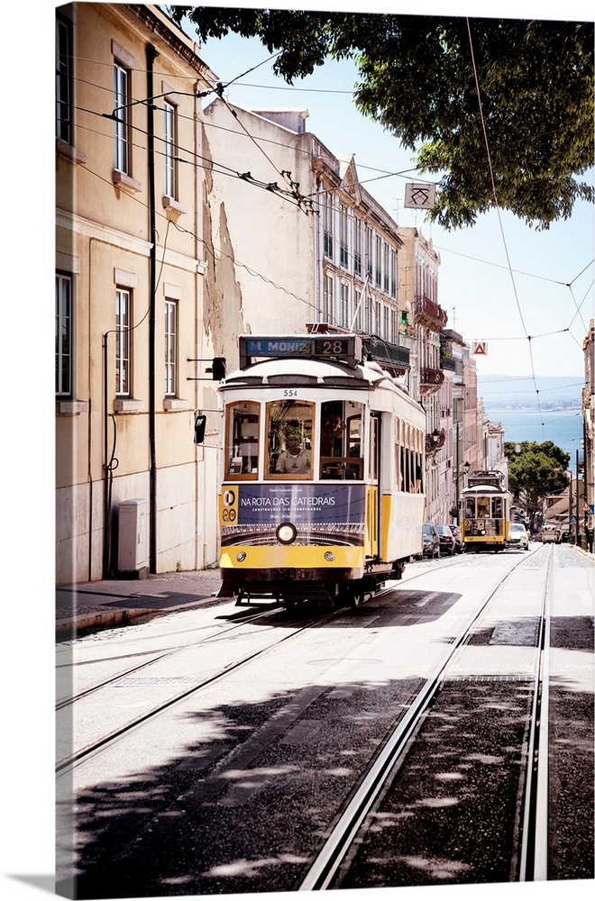 This is the famous old yellow tramway 28 in the streets of lisbon in Portugal.