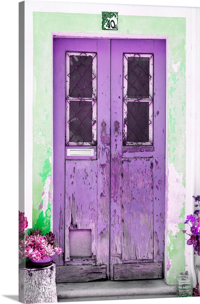 It's an old purple door entrance to a traditional house in Portugal.