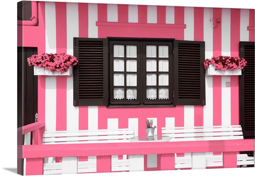 It's a facade with pink stripes of traditional house in costa Nova beach in Portugal.
