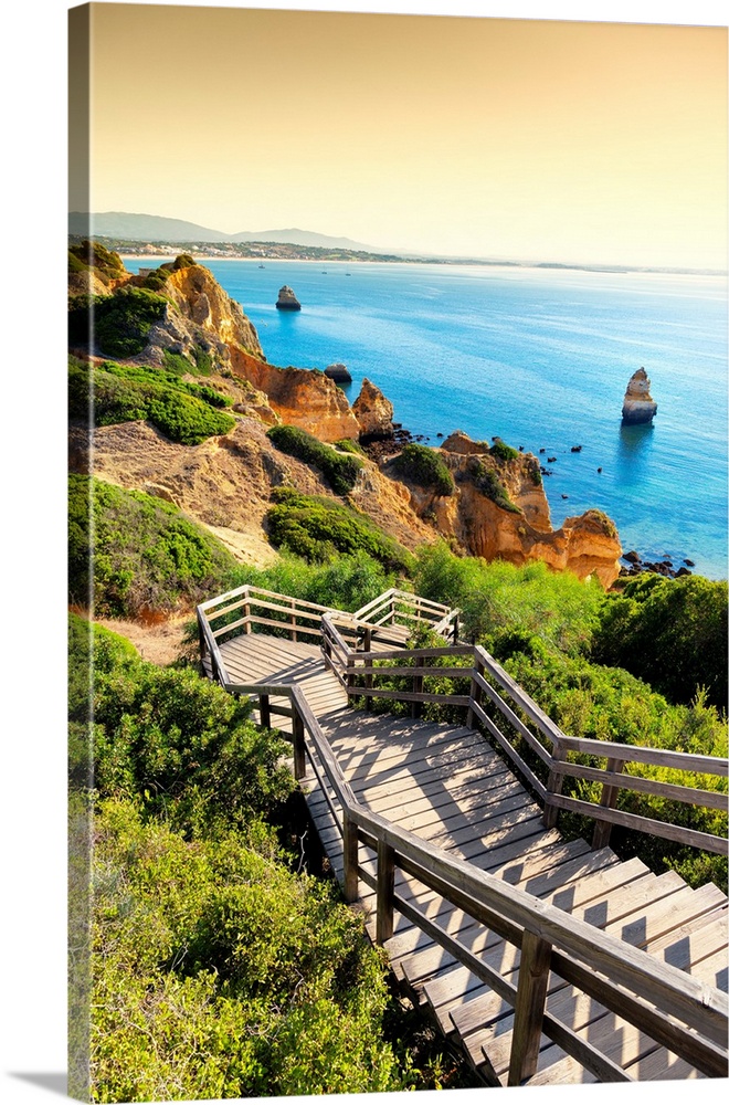 It's the wooden staircase at sunset that goes down to the Praia do Camillo in Lagos (Portugal).
