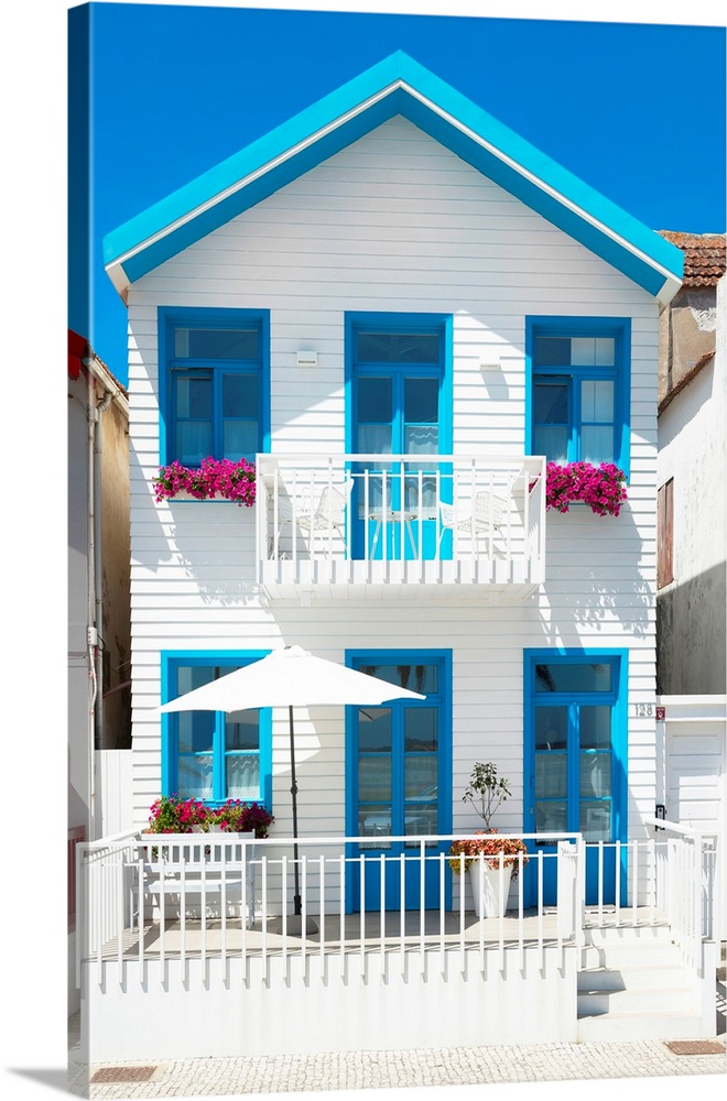 It's a traditional white and blue house in Costa Nova Beach in Portugal.