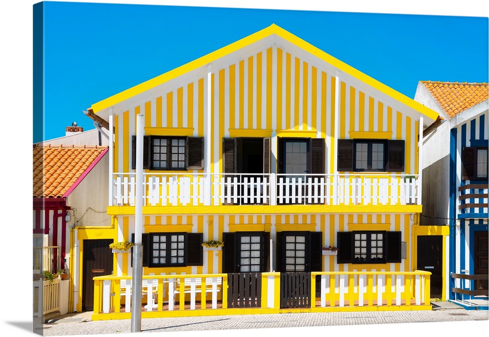 It's a a typical house with yellow stripes in Costa Nova Beach, Portugal.