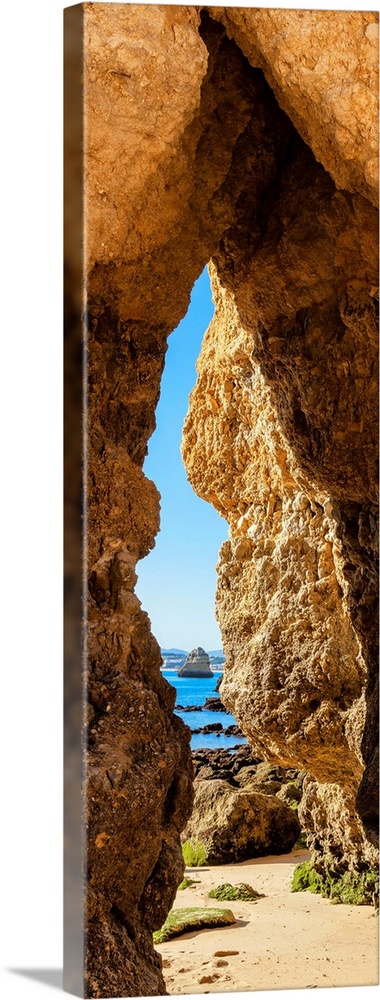 It's a natural passage in a rock cliff on the beach of Praia do Camillo in Lagos (Portugal).