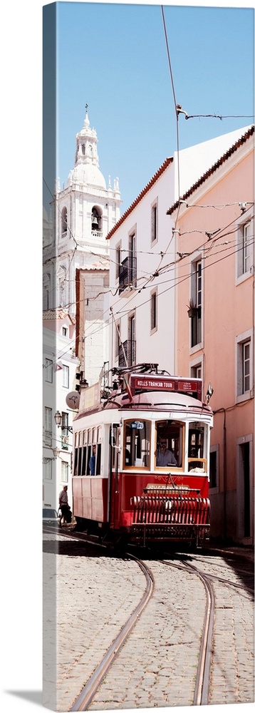 It's a typical Lisbon street with a church and colorful Facades and the red tram in Portugal.
