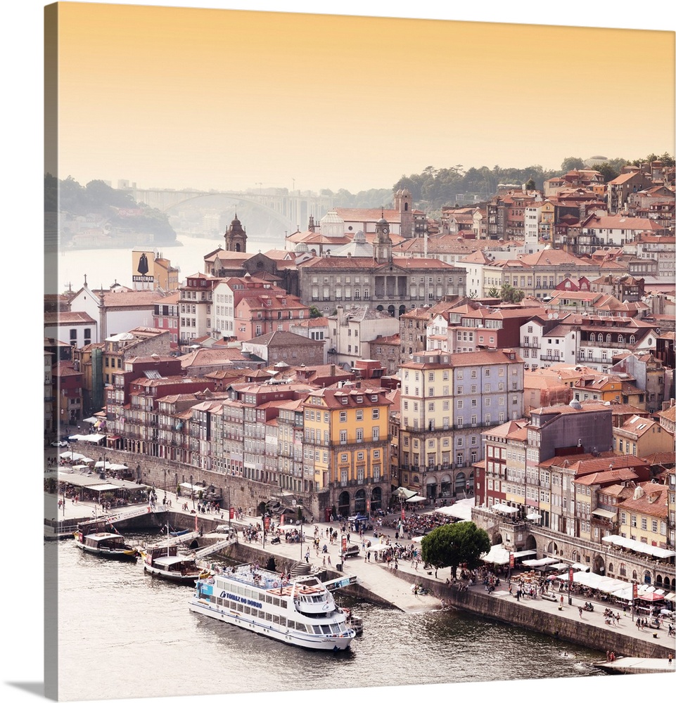 It's a landscape picture of the city of Porto (Portugal) along the Douro River and the medieval district of Ribeira at sun...