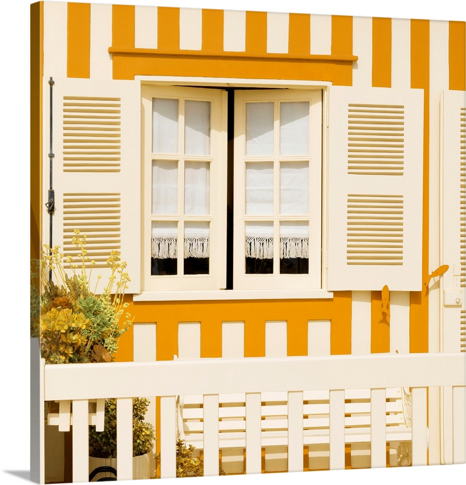 Its' a traditional window with yellow stripes at Costa Nova Beach in Portugal.