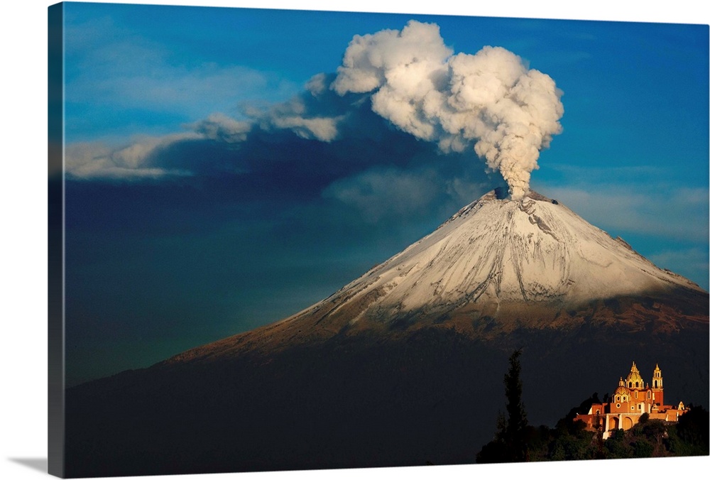Clouds of ash rising from snowy  Popocatepetl volcano, Mexico.