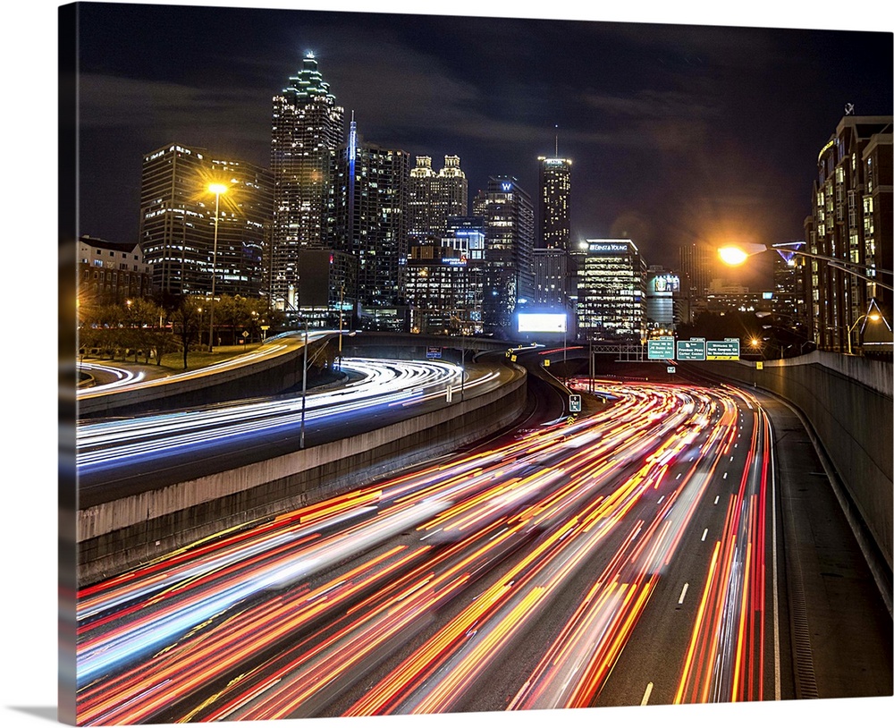 Light trails from traffic leading into the city of Atlanta, Georgia, at night.