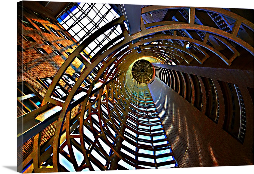 Photograph looking up through a tunnel up to an atrium.