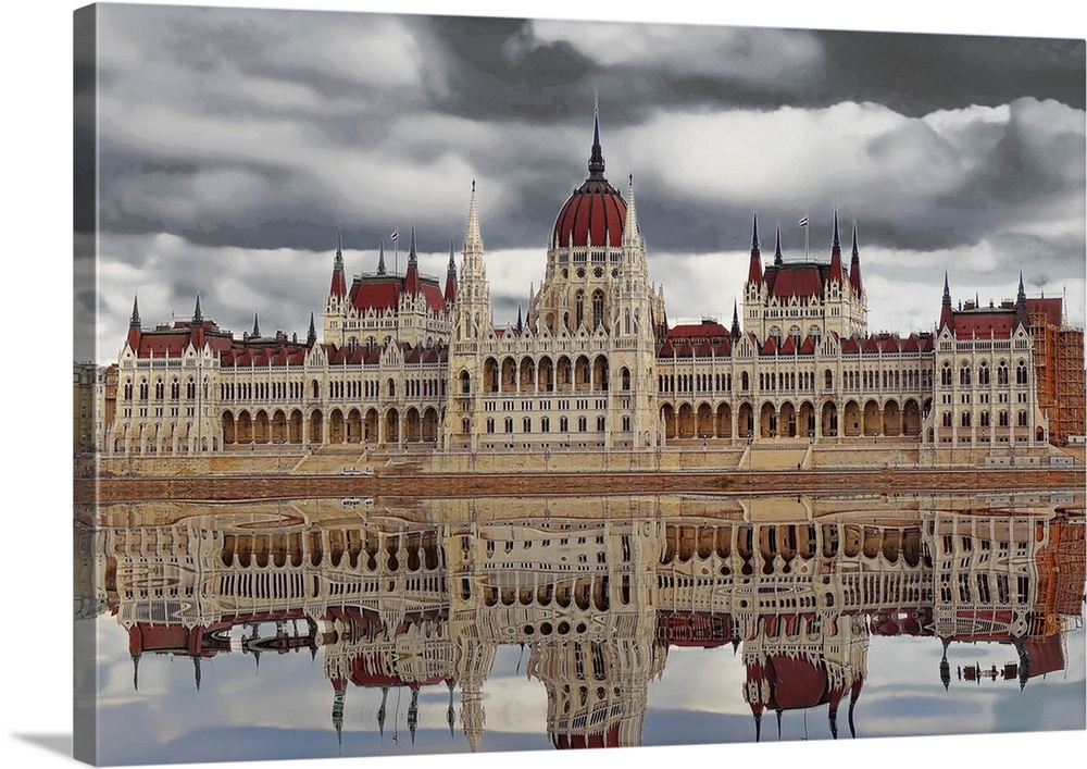Budapest cityscape reflected in the water of the river below on a cloudy day.