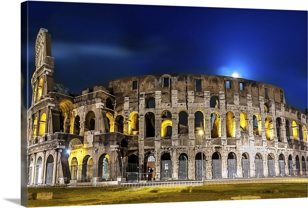 The Colosseum in Rome lit up at night.