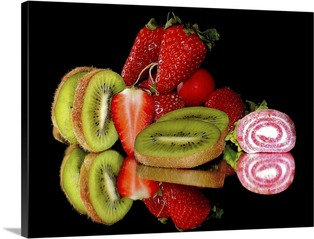 Kiwis, strawberries, and candy on a mirror.