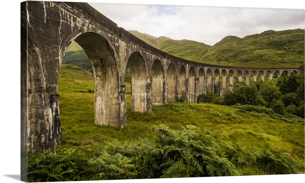 Stone viaduct with an impressive arch system in the countryside of Scotland.