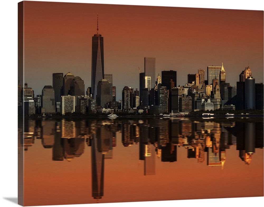 The New York City skyline perfectly mirrored in the bay below.